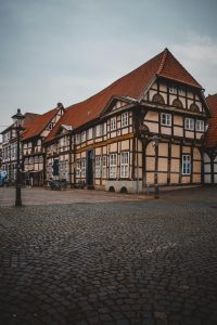 Charming view of traditional timber-framed houses in Nienburg, Germany, captured on a cloudy day.